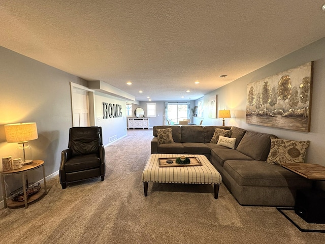 carpeted living area featuring baseboards, recessed lighting, a textured ceiling, and visible vents
