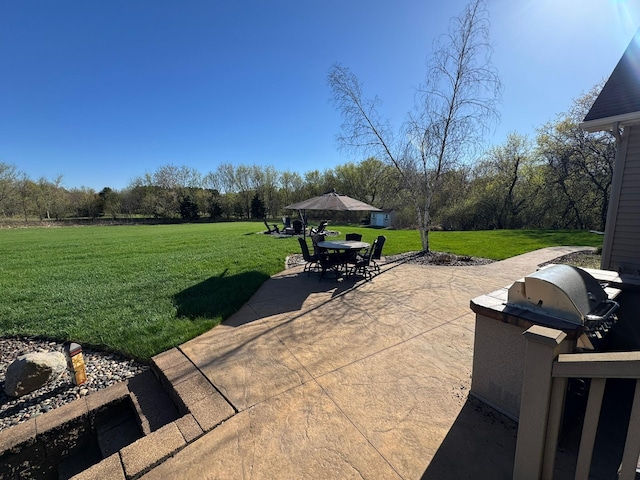 view of patio featuring outdoor dining space and area for grilling