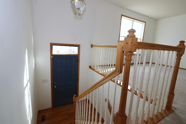 1728 Riverside Dr, Shakopee, MN 55379 - entryway featuring baseboards, carpet flooring, wood finished floors, and visible vents