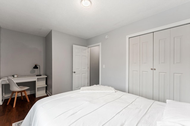421 Robert St S, Saint Paul, MN 55107 - bedroom featuring a closet, baseboards, and dark wood finished floors