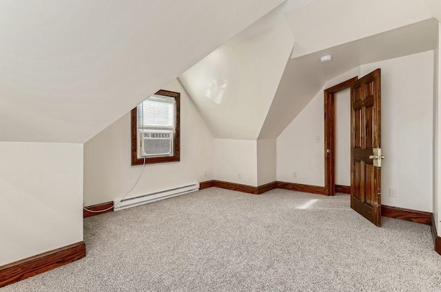 bonus room featuring lofted ceiling, a baseboard radiator, baseboards, and carpet floors
