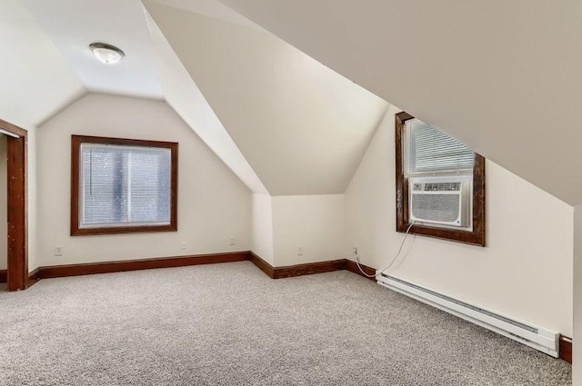 bonus room featuring a baseboard heating unit, carpet flooring, cooling unit, baseboards, and lofted ceiling