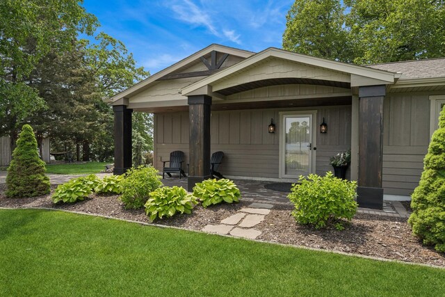 11831 Gulden Ave NW, Maple Lake, MN 55358 - view of exterior entry with a lawn