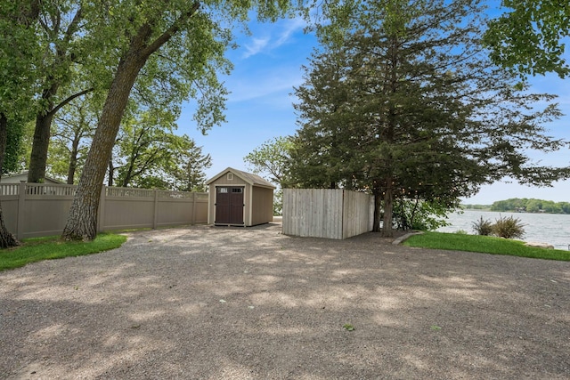11831 Gulden Ave NW, Maple Lake, MN 55358 - view of yard featuring a shed and a water view