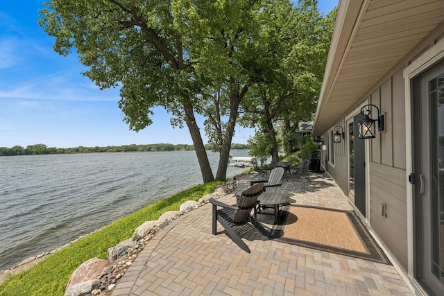 11831 Gulden Ave NW, Maple Lake, MN 55358 - view of patio featuring a water view