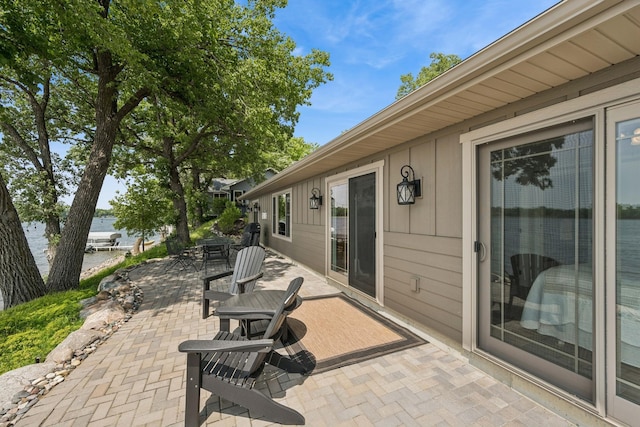 11831 Gulden Ave NW, Maple Lake, MN 55358 - view of patio featuring a water view
