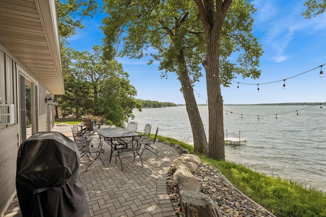 11831 Gulden Ave NW, Maple Lake, MN 55358 - view of patio / terrace featuring outdoor dining space, a water view, and grilling area