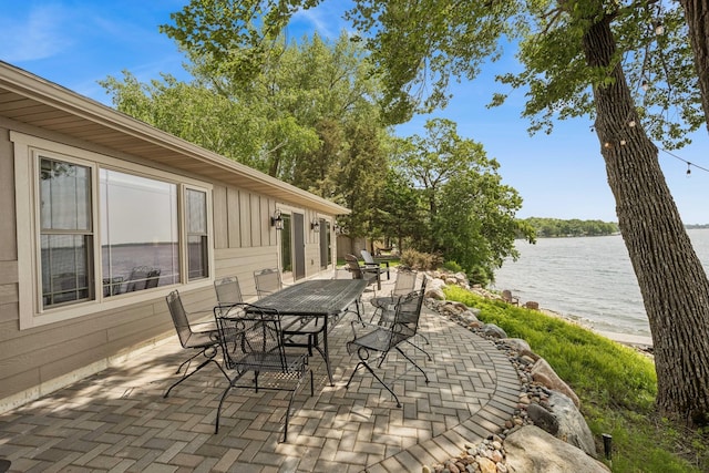11831 Gulden Ave NW, Maple Lake, MN 55358 - view of patio featuring a water view and outdoor dining space