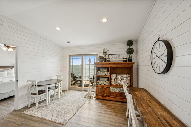 11831 Gulden Ave NW, Maple Lake, MN 55358 - dining area featuring wooden walls, lofted ceiling, wood finished floors, recessed lighting, and a ceiling fan