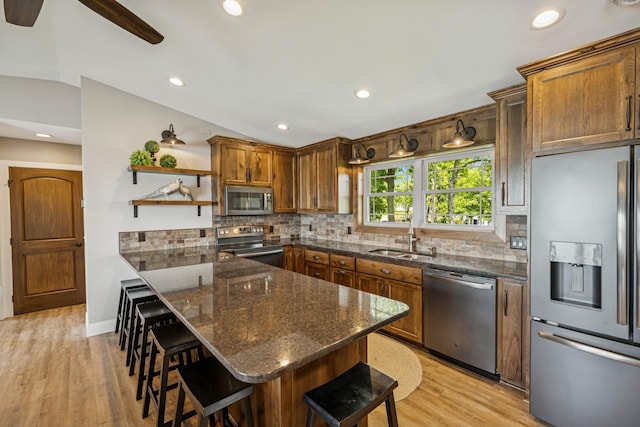 11831 Gulden Ave NW, Maple Lake, MN 55358 - kitchen featuring stainless steel appliances, a kitchen bar, open shelves, decorative backsplash, and recessed lighting
