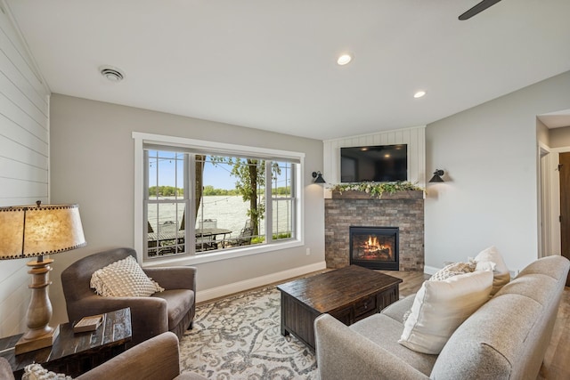 11831 Gulden Ave NW, Maple Lake, MN 55358 - living area with a fireplace, recessed lighting, and wood finished floors