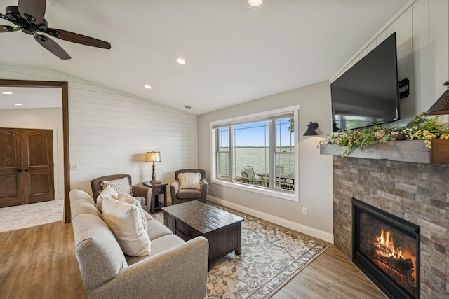 11831 Gulden Ave NW, Maple Lake, MN 55358 - living area featuring wood finished floors, a brick fireplace, lofted ceiling, ceiling fan, and recessed lighting