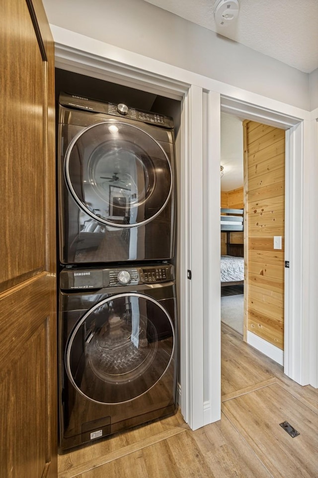 11831 Gulden Ave NW, Maple Lake, MN 55358 - laundry area with estacked washer and dryer and light wood finished floors