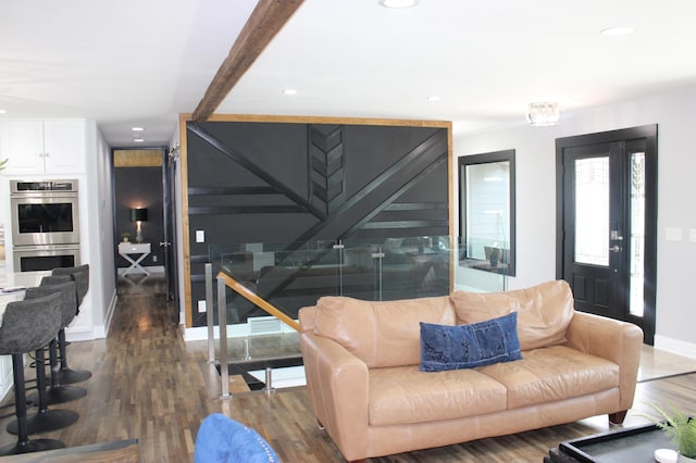 living room featuring wood finished floors, recessed lighting, and baseboards