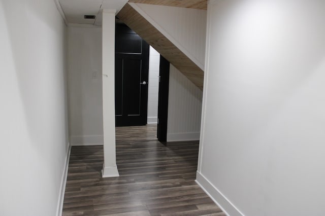 corridor featuring wood finished floors and baseboards