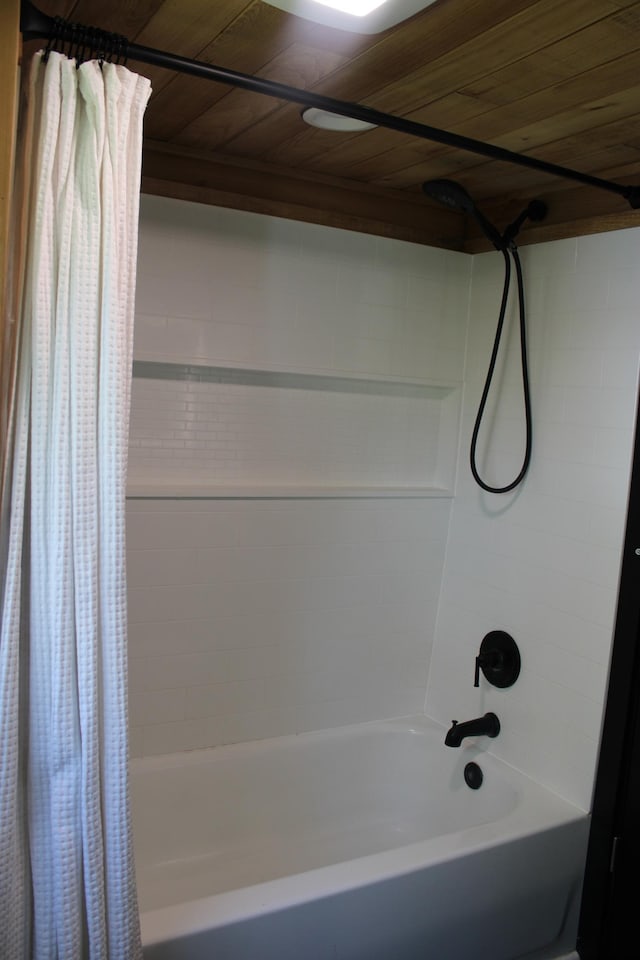 bathroom featuring shower / bath combo with shower curtain and wood ceiling