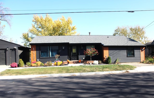 view of front of property featuring roof with shingles