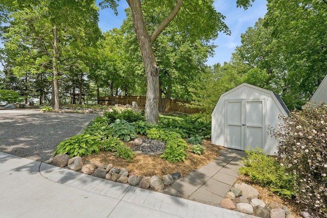 11847 Gulden Ave NW, Maple Lake, MN 55358 - view of yard with a shed and view of wooded area