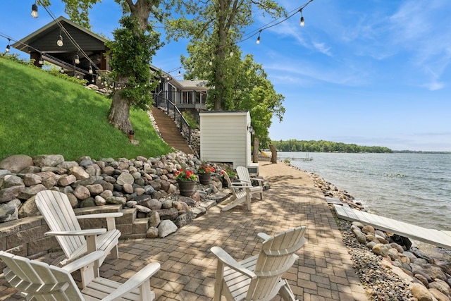 11847 Gulden Ave NW, Maple Lake, MN 55358 - view of patio / terrace with a water view, stairway, and a dock