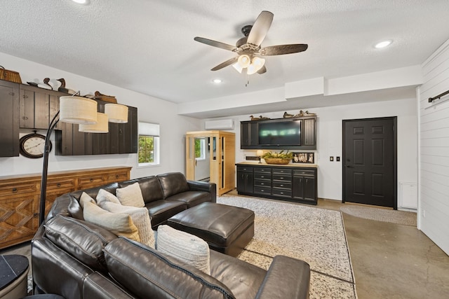 11847 Gulden Ave NW, Maple Lake, MN 55358 - living room with a wall unit AC, a ceiling fan, concrete floors, a textured ceiling, and recessed lighting