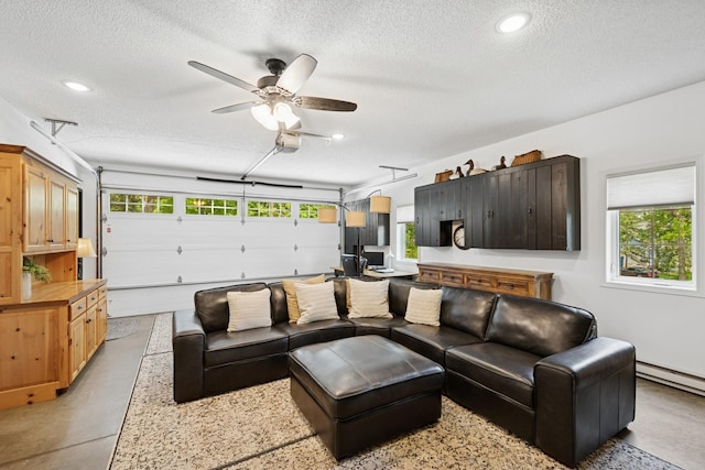11847 Gulden Ave NW, Maple Lake, MN 55358 - living room featuring a textured ceiling, concrete flooring, ceiling fan, recessed lighting, and baseboard heating