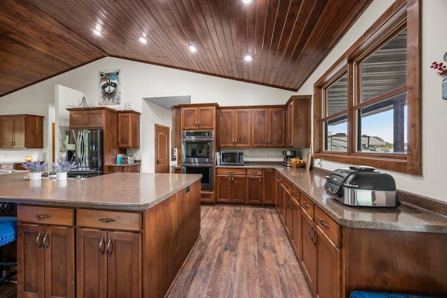 1116 County Road 46, Clearwater, MN 55320 - kitchen featuring appliances with stainless steel finishes, wood ceiling, a center island, dark wood-style floors, and dark countertops