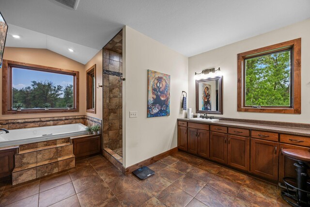 1116 County Road 46, Clearwater, MN 55320 - full bathroom featuring a tile shower, a garden tub, vanity, baseboards, and lofted ceiling