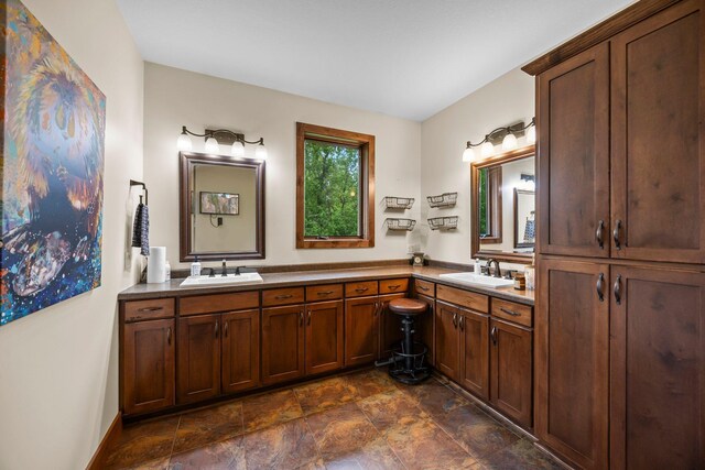 1116 County Road 46, Clearwater, MN 55320 - bathroom featuring double vanity and stone finish flooring