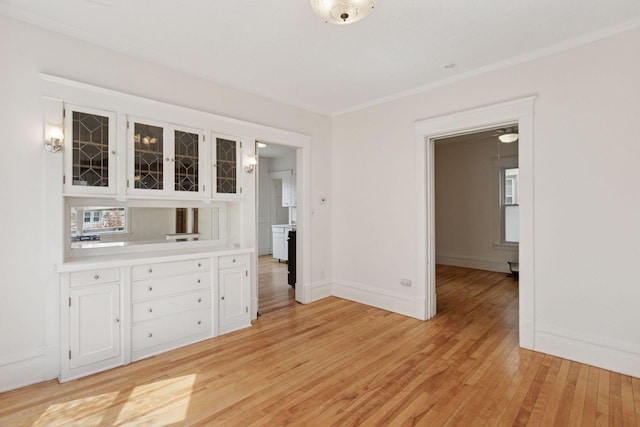 650 Pierce St NE, Minneapolis, MN 55413 - unfurnished dining area with light wood-style floors and baseboards