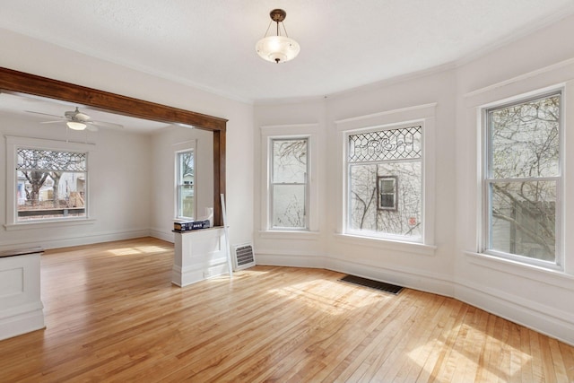 650 Pierce St NE, Minneapolis, MN 55413 - interior space with light wood-style floors, baseboards, ceiling fan, and visible vents