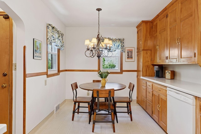 1804 Pinehurst Ave, Saint Paul, MN 55116 - dining space with arched walkways, a chandelier, and light flooring