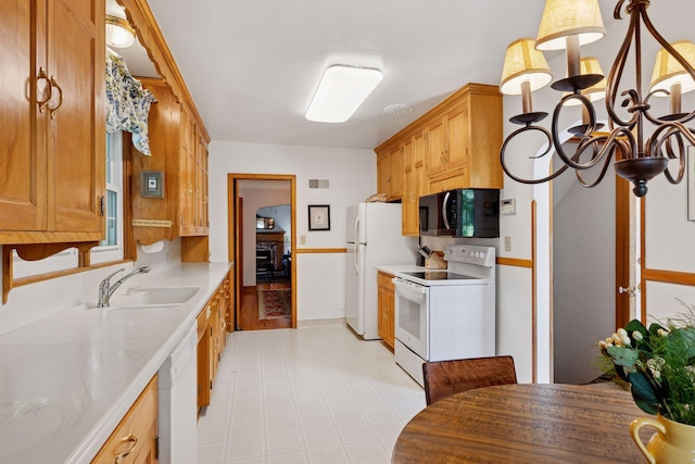 1804 Pinehurst Ave, Saint Paul, MN 55116 - kitchen featuring white appliances, light countertops, and light floors