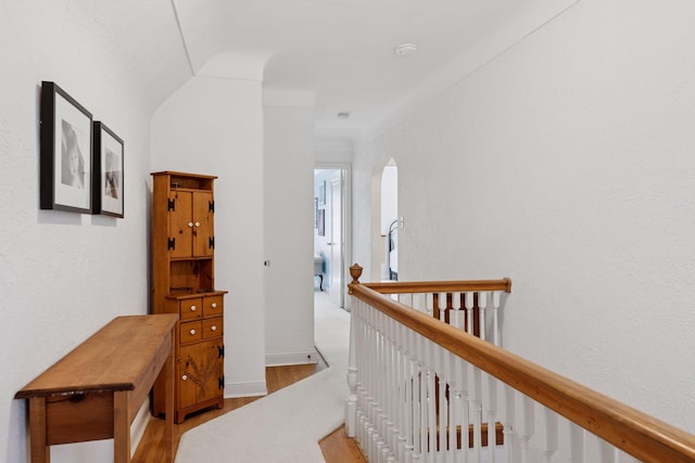 1804 Pinehurst Ave, Saint Paul, MN 55116 - hallway with light wood-style flooring, an upstairs landing, and arched walkways