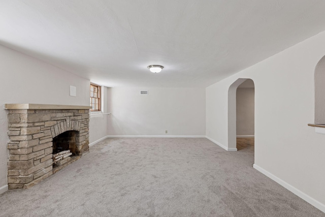 1804 Pinehurst Ave, Saint Paul, MN 55116 - unfurnished living room with arched walkways, a fireplace, and carpet flooring