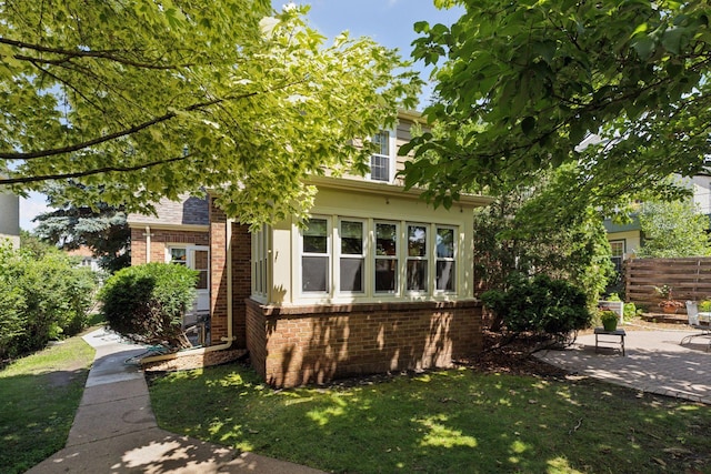 1804 Pinehurst Ave, Saint Paul, MN 55116 - obstructed view of property with a patio area and brick siding