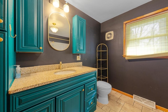 bathroom featuring toilet, baseboards, visible vents, tile patterned floors, and vanity