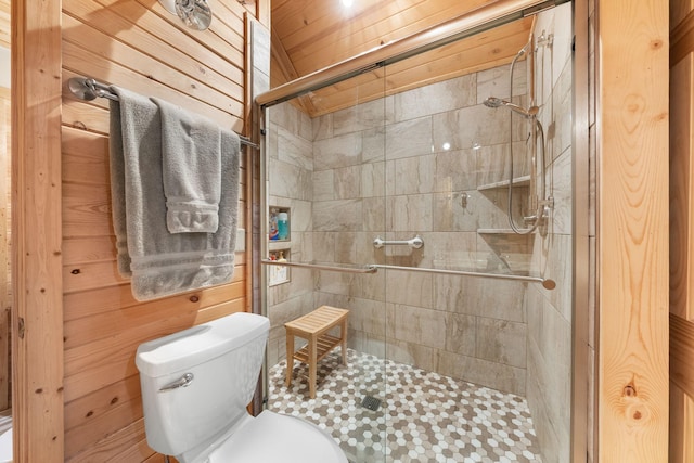 full bathroom featuring toilet and a stall shower