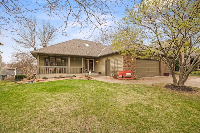 view of front of house with a front yard, concrete driveway, a garage, and covered porch