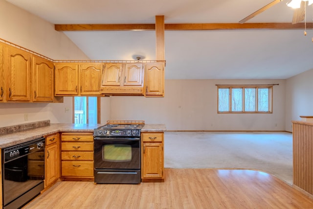 kitchen featuring light countertops, lofted ceiling with beams, black appliances, and a wealth of natural light