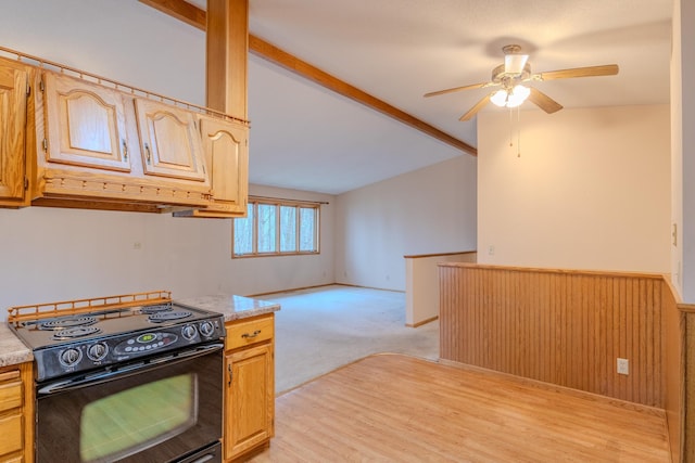 kitchen featuring light countertops, a ceiling fan, lofted ceiling, black range with electric cooktop, and custom exhaust hood