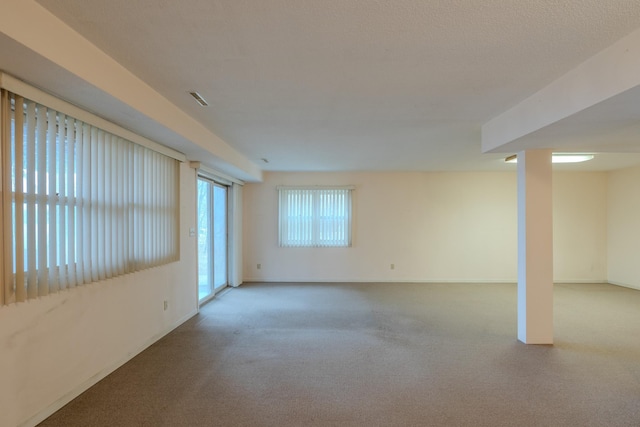 interior space with baseboards and carpet flooring