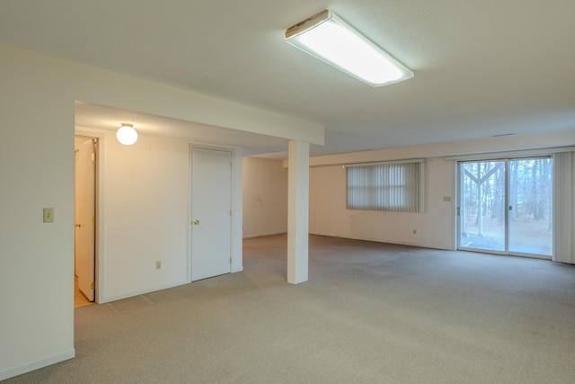 below grade area featuring carpet floors