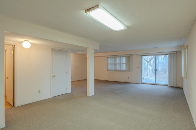 below grade area with light carpet