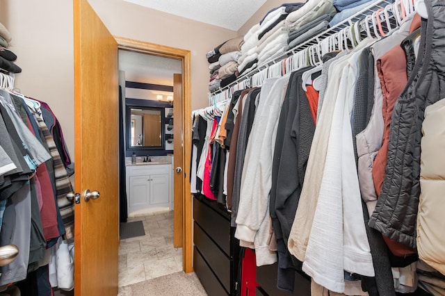 3831 232nd Ave NW Unit 105, Saint Francis, MN 55070 - spacious closet with a sink and light stone finish flooring