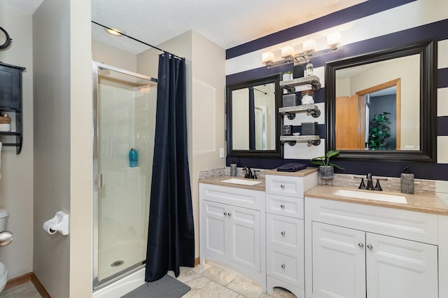 3831 232nd Ave NW Unit 105, Saint Francis, MN 55070 - full bathroom featuring a stall shower, double vanity, toilet, and a textured ceiling
