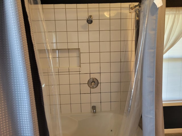 full bathroom featuring shower / tub combo with curtain