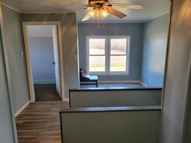 interior space with baseboards and dark wood-style floors
