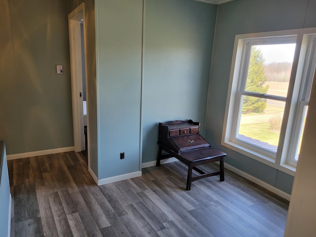 sitting room featuring wood finished floors and baseboards