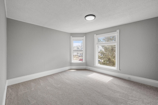 1527 Minnehaha Ave W, Saint Paul, MN 55104 - unfurnished room with a textured ceiling, a textured wall, carpet floors, and baseboards