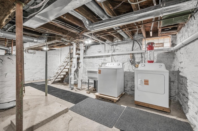 1527 Minnehaha Ave W, Saint Paul, MN 55104 - basement with a sink, water heater, and independent washer and dryer